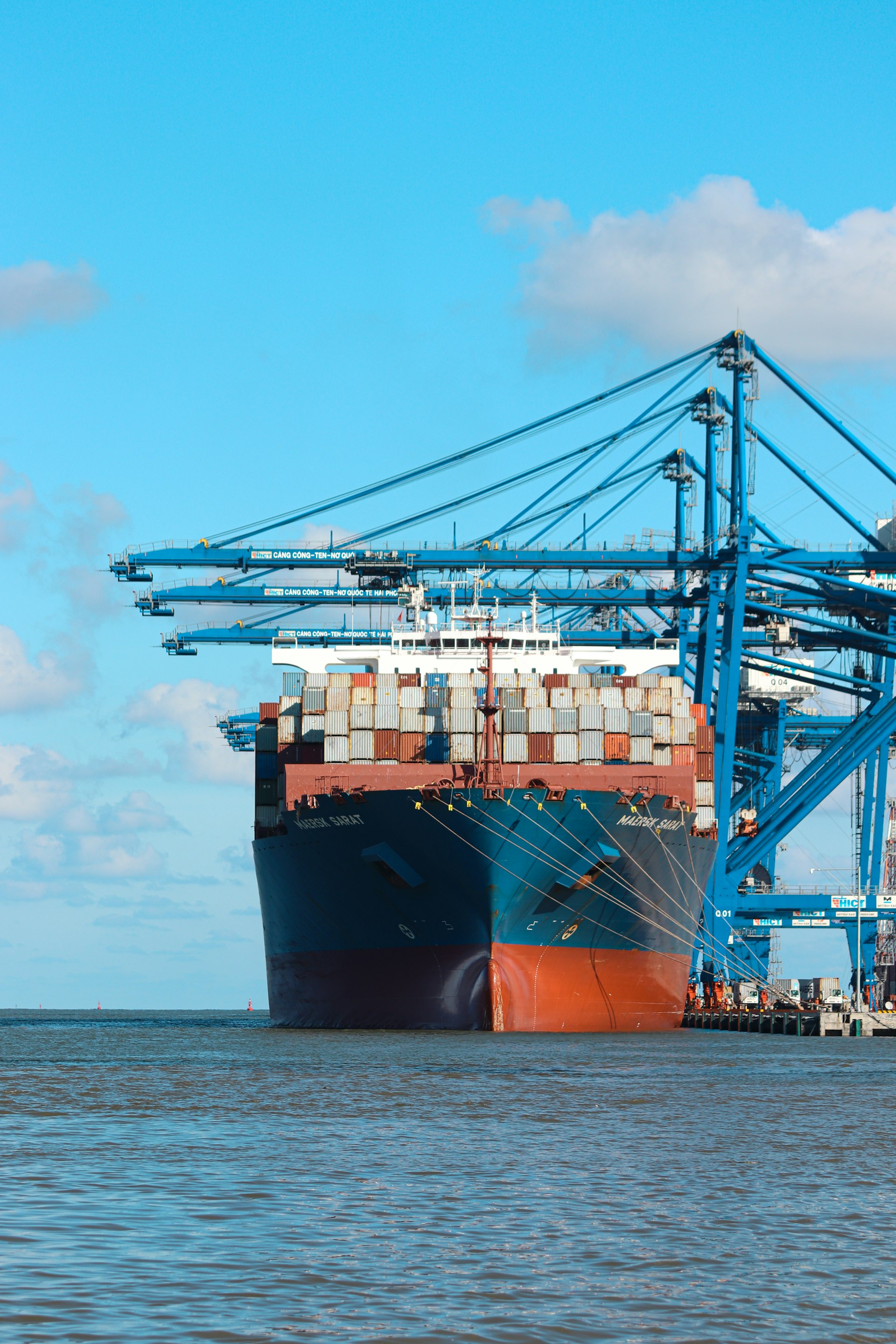 Container ship loading at an international port terminal